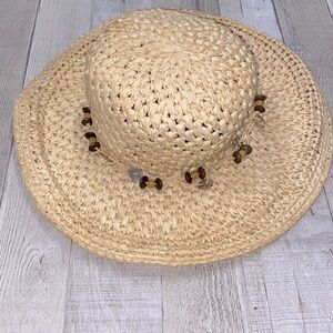 Jaclyn Smith straw hat for summer vacay; gardening